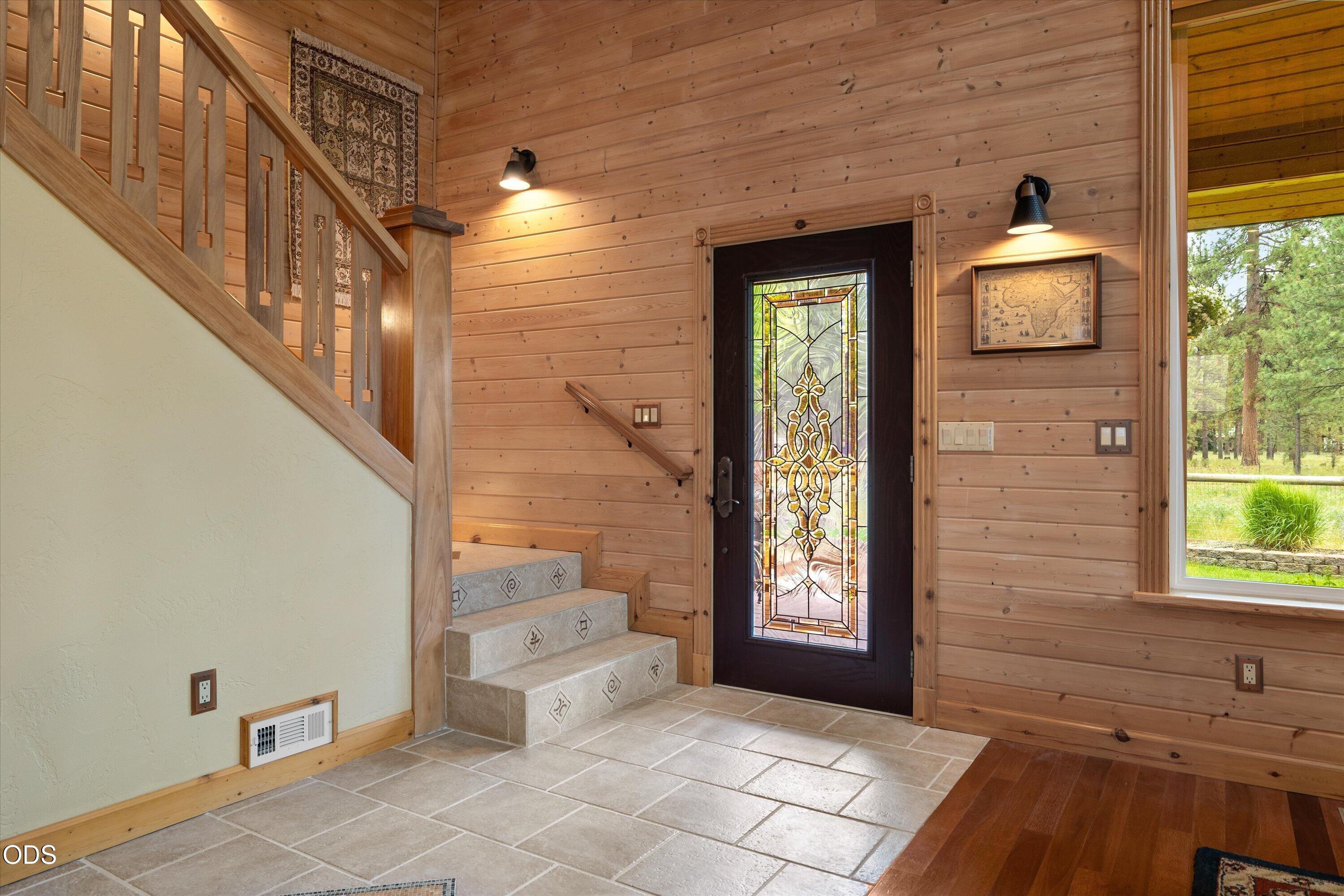 Custom stair railing leads up to the loft and two very well sized bedrooms.