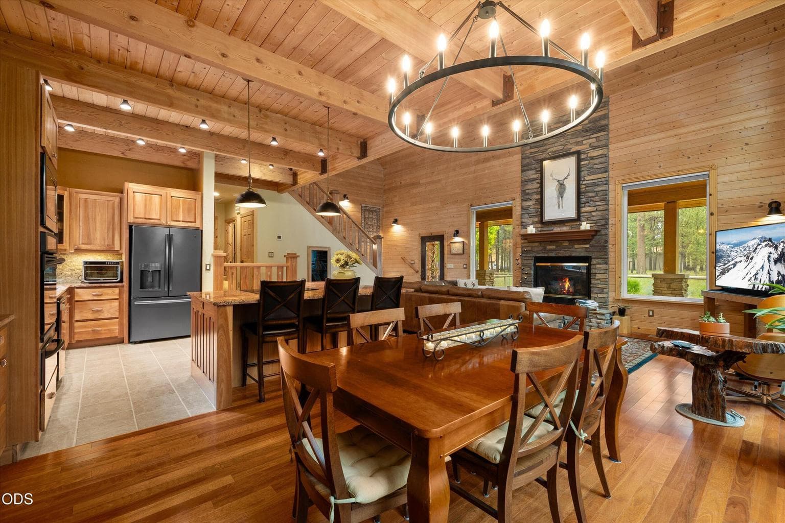 An oversized chandelier defines the dining area for entertaining.