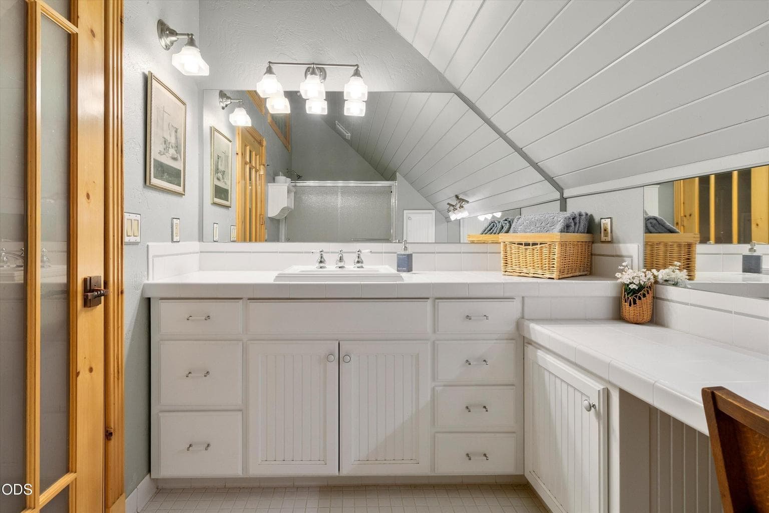 Lots of storage and light abound in this 2nd level bath.