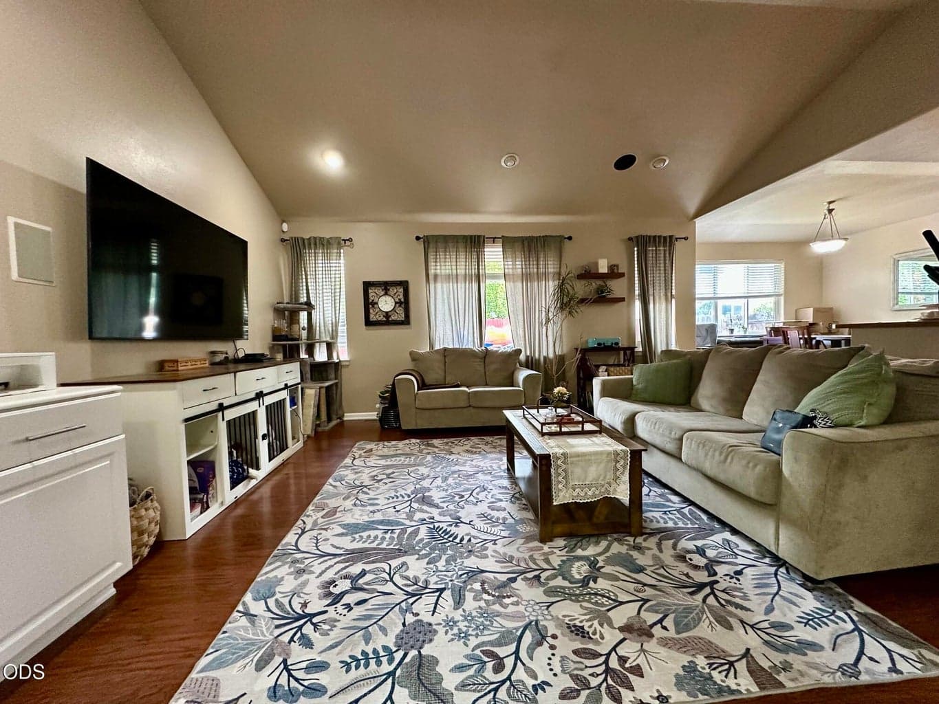 Spacious Open concept living space with vaulted ceiling.