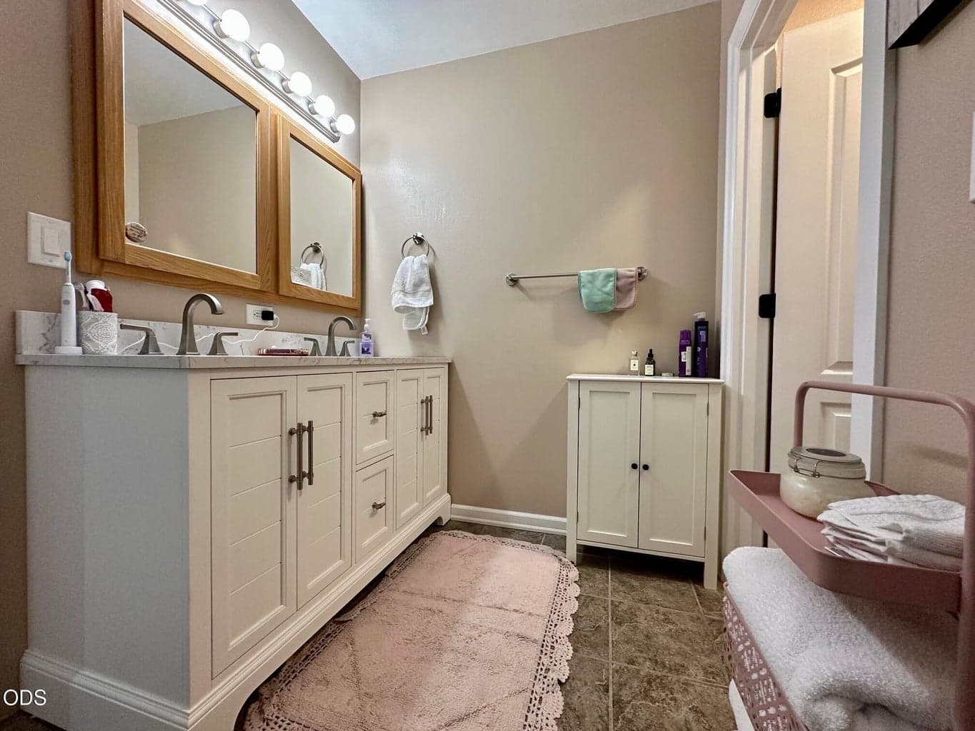 Primary Bathroom with dual vanity and large walk in closet.