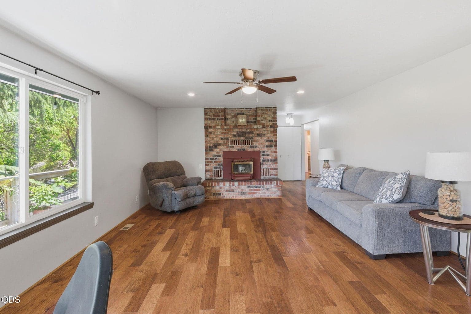 Lovely fireplace in the living room. Perfect to enjoy a relaxing evening in the cooler months overlooking your beautifuly landscaped yard and the views of the valley.