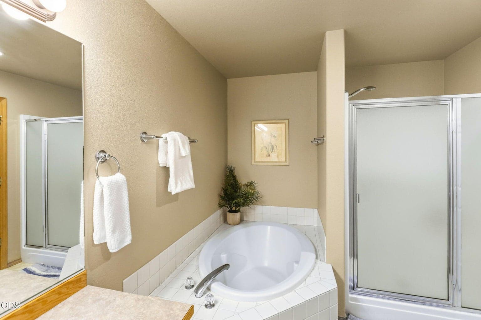 Second primary bath with walk in shower and large soaking tub