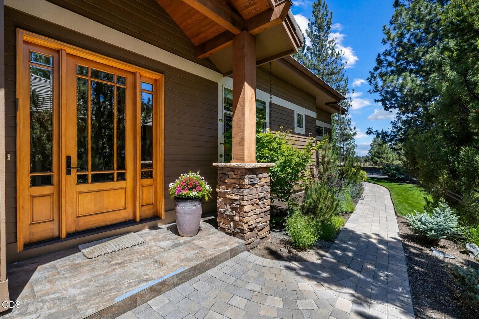 Single-level Broken Top townhome in a peaceful golf course setting with mature landscaping and easy-maintenance exterior living.