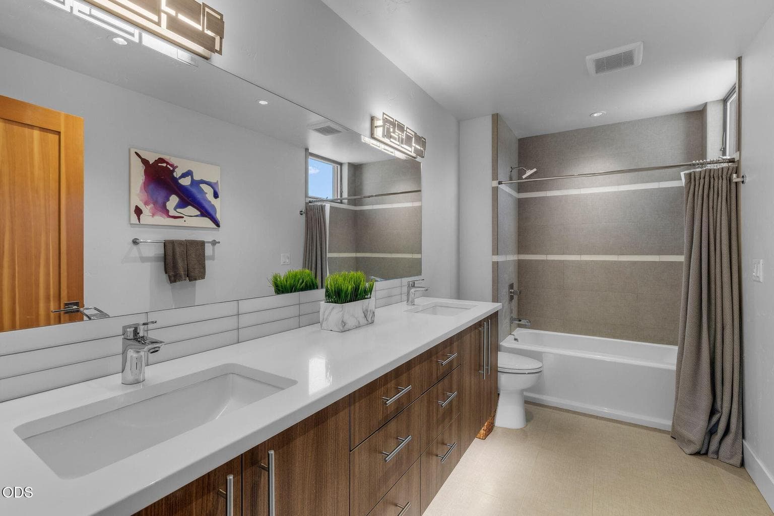 Double vanities and tiled shower