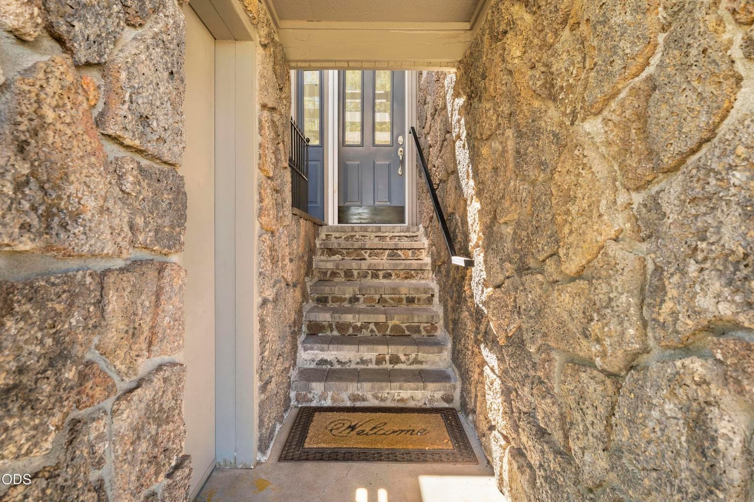 rock faced entry to main level