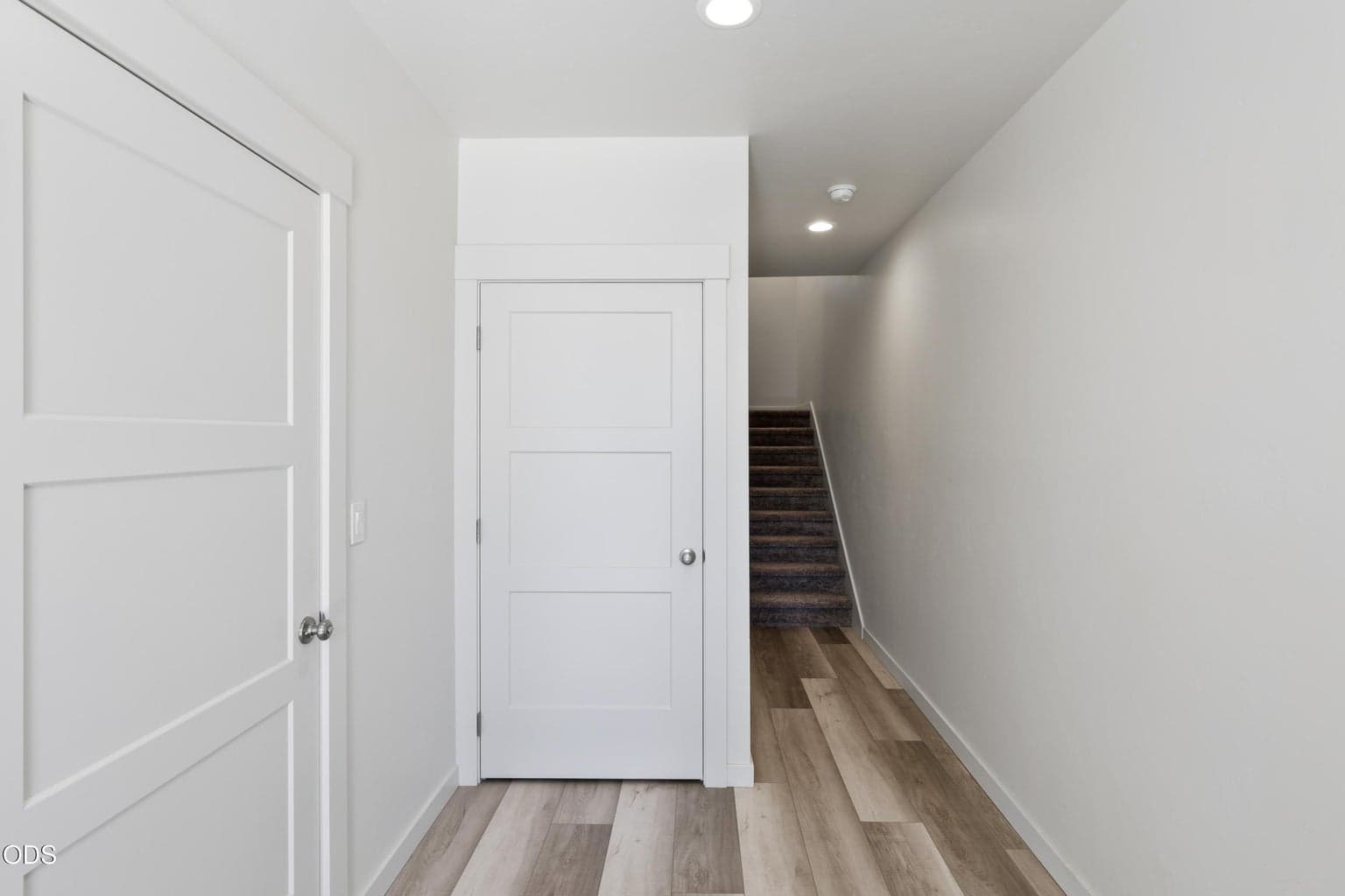 lower level feature s garage space, coat closet and stairs up to main level