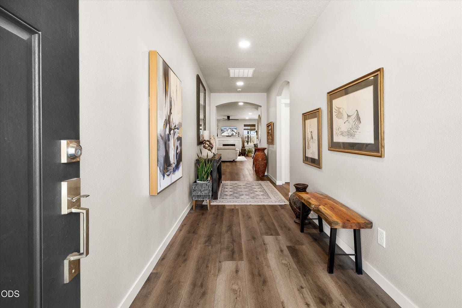 Welcoming entrance to a spacious foyer with walls suited for oversized artwork.
