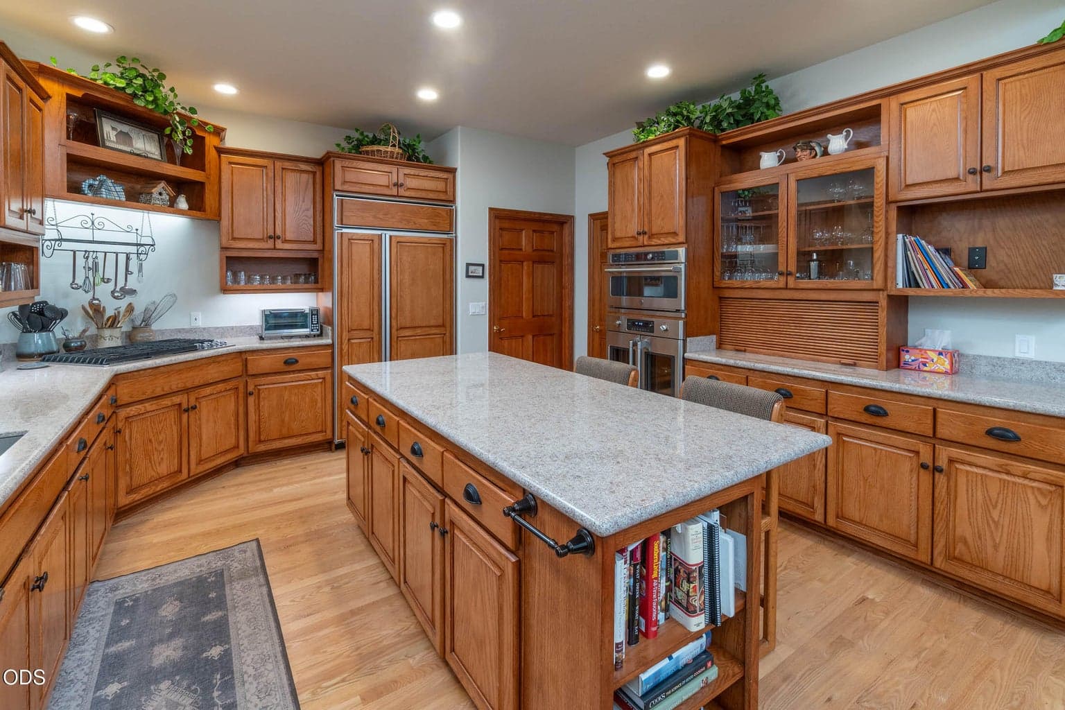 Granite slab countertops with Oack cabinets and hickory stain