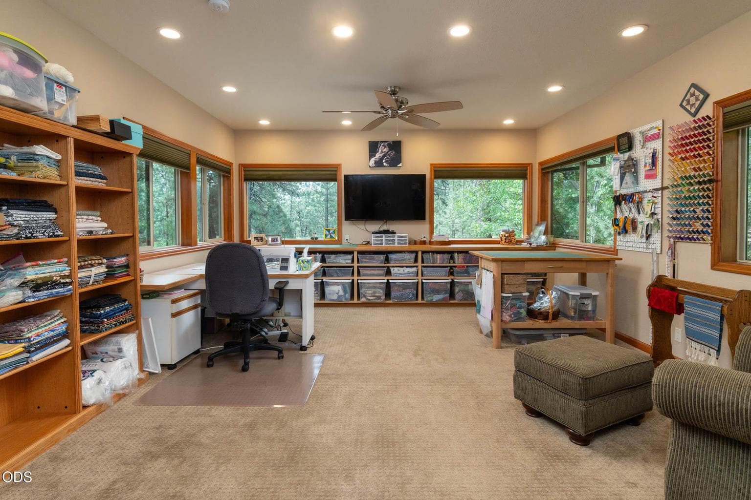 Quilting room with lots of build in cabinets, could easily be converted into a 4th bedroom