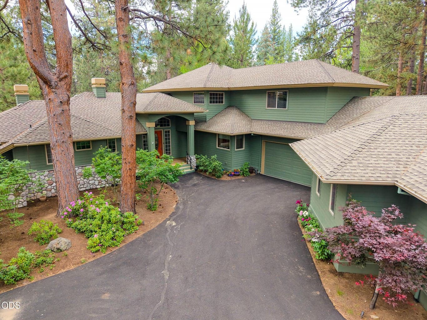 Entry door and garage door to the right
