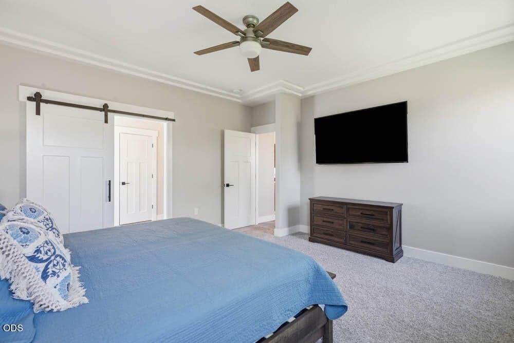 Barn door into primary bath and closet