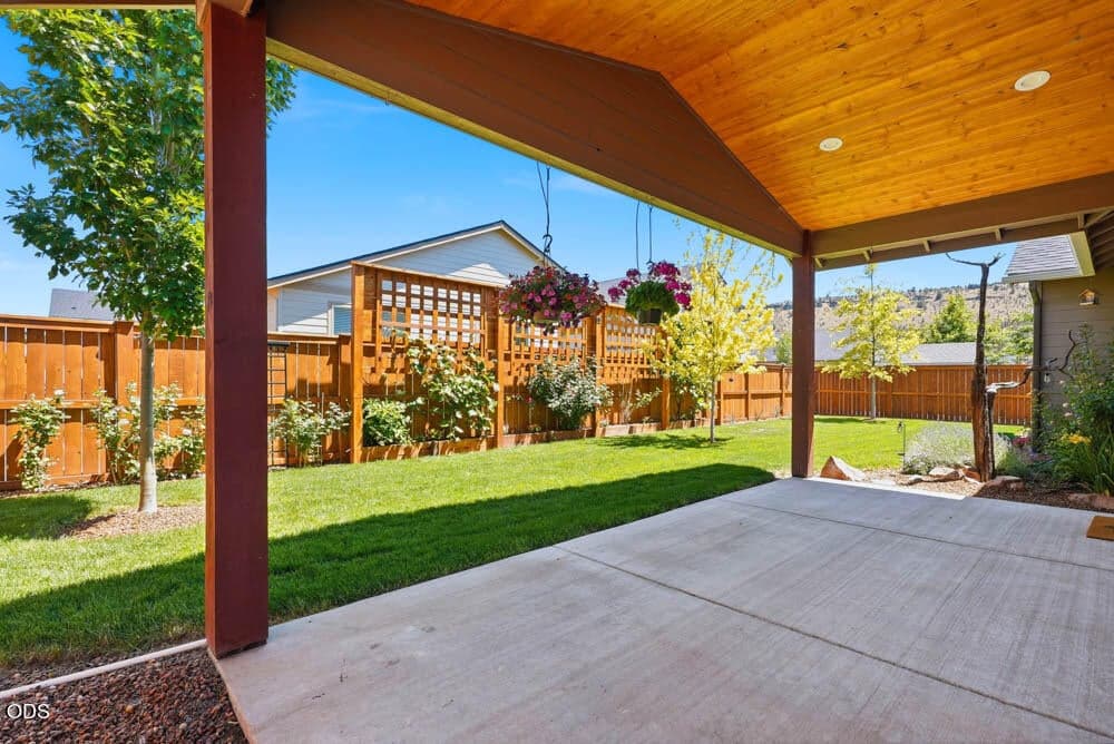 Stunning grassy yard with side yard perfect for dog run or storage