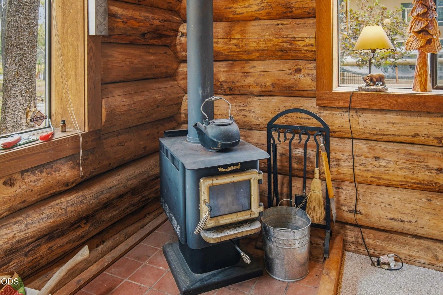A traditional wood stove adds warmth, character, and the unmistakable comfort of a true Central Oregon cabin.