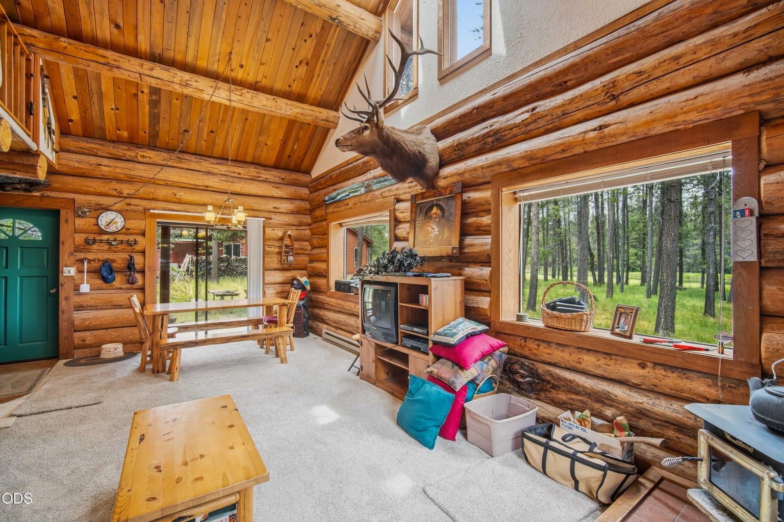 Windows facing the wooded riverfront setting fill the great room with natural light and keep the landscape present indoors.