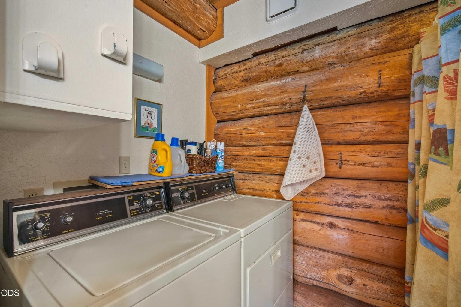 In-cabin laundry and utility space make the property practical for weekend visits, seasonal stays, or full-time use.