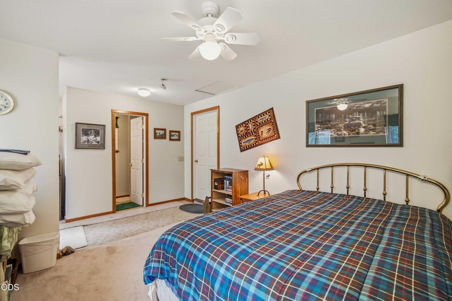 The separate conditioned guest bedroom provides additional sleeping space with direct access to its private bathroom. County records identify the permitted area as a bedroom and bathroom.