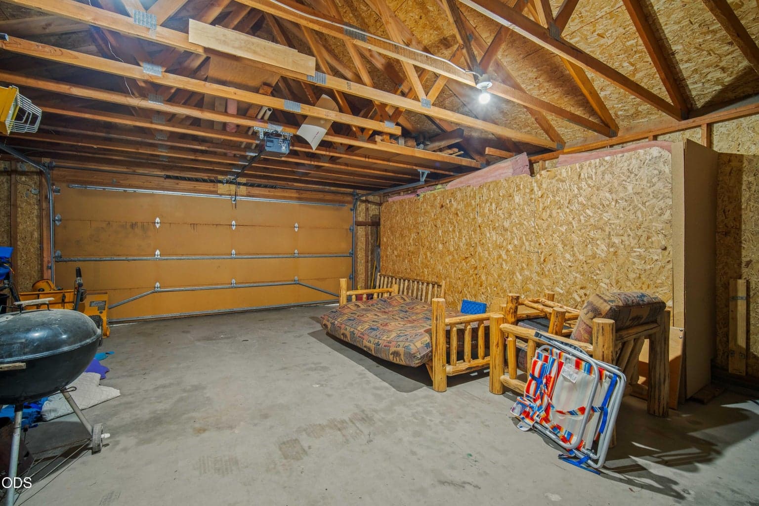 The detached garage offers flexible storage and workspace for tools, outdoor equipment, and river gear.