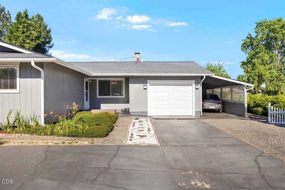 One-car attached garage and carport with storage