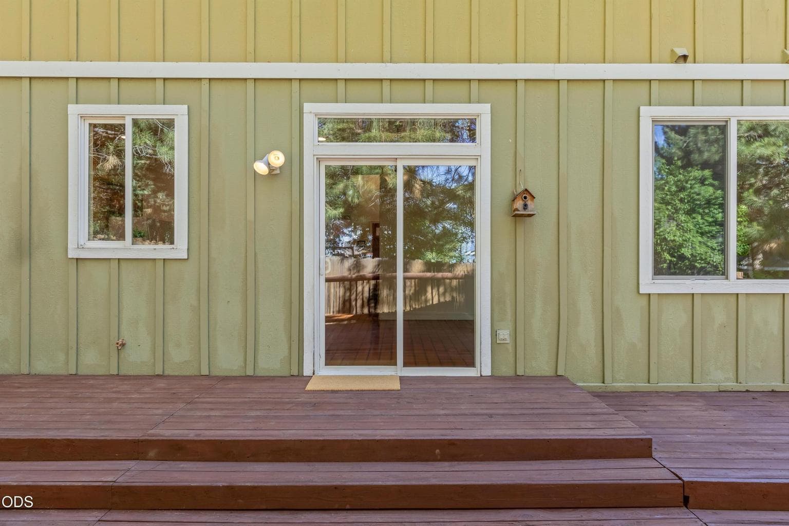 The back yard is adjacent to a protected, forested community space on one side and a community walking / biking path on the other side.