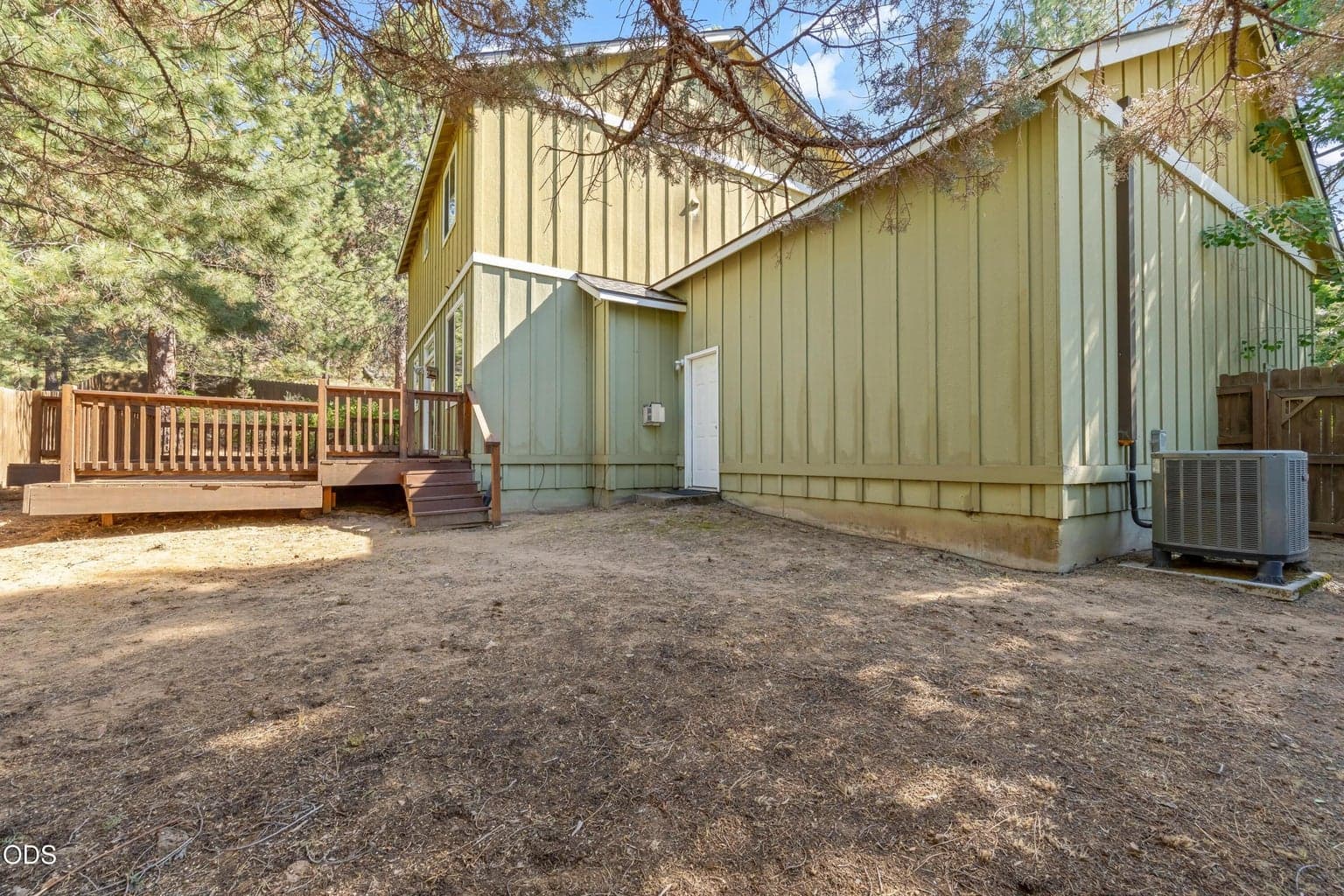The back yard is a large, fenced blank canvas! One portion of the back yard is completely cleared. The other side is native vegetation with manzanita, shrubs and trees.