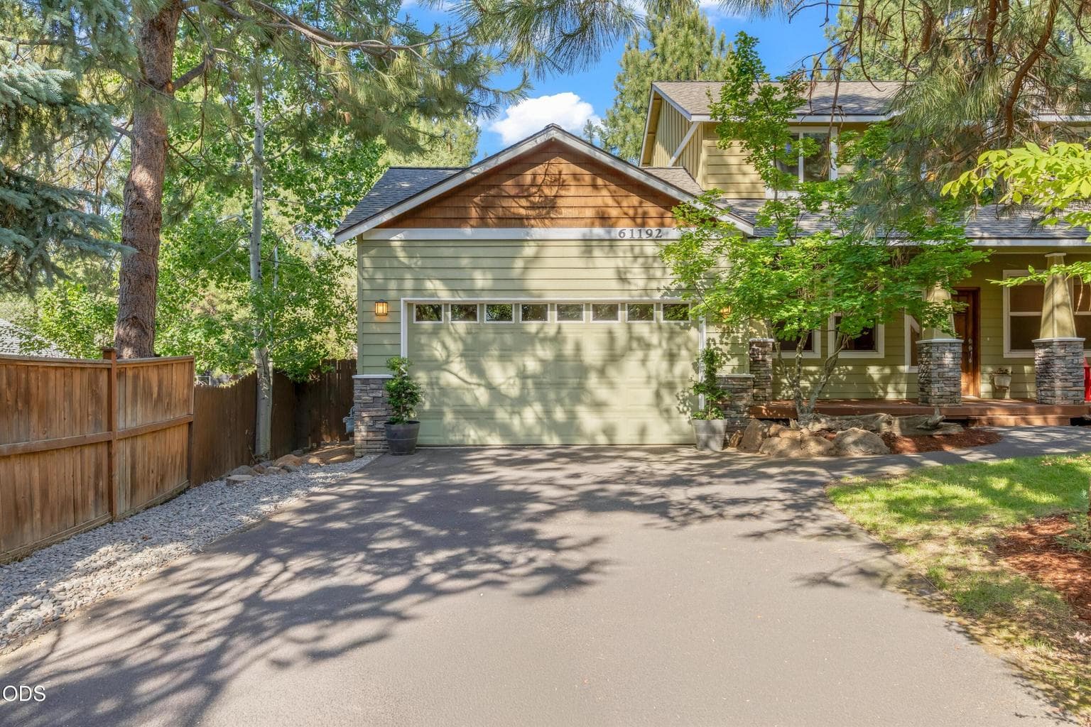 Two car garage with high ceiling which allows for hanging loft storage if desired..