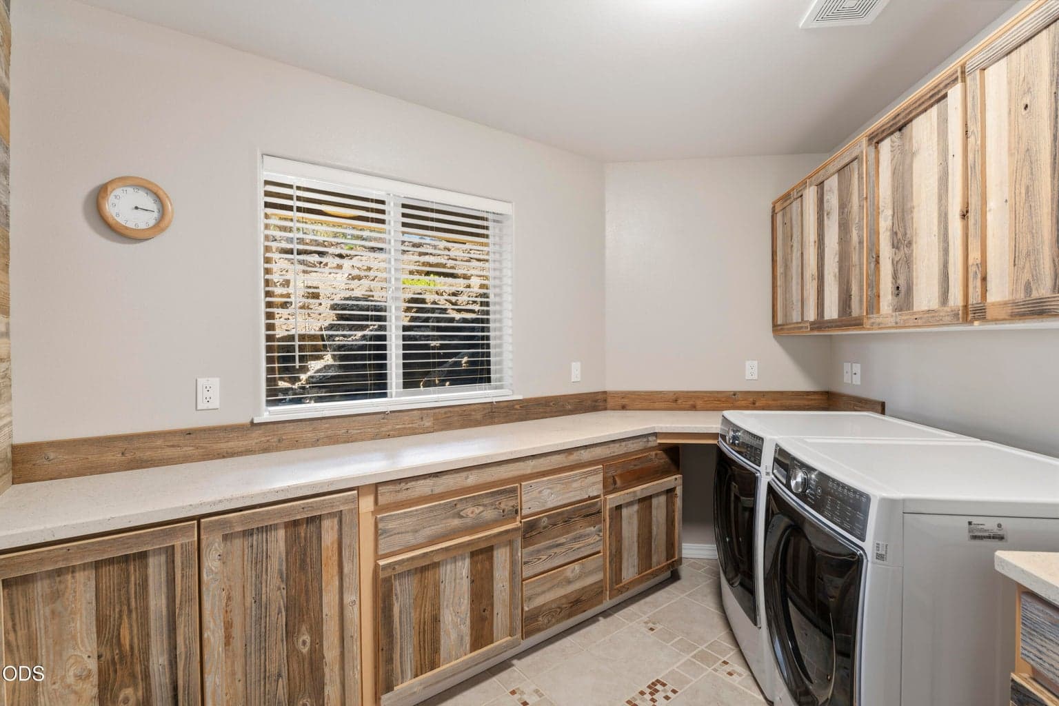 Laundry w tons of storage and reclaimed wood