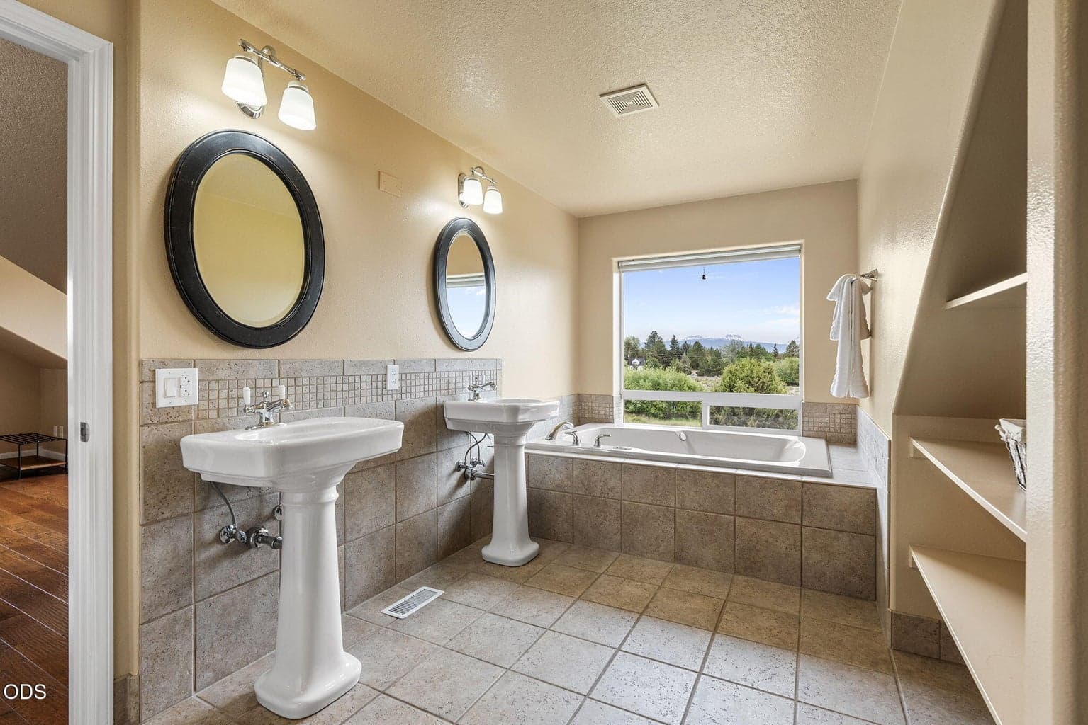 Upstairs Primary Bathroom with jetted tub and Cascade Mountain views