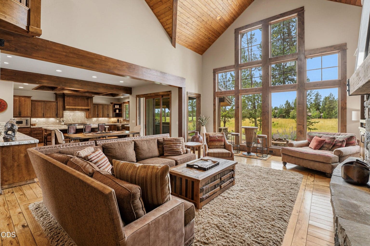 An open-concept design seamlessly connects the great room, dining area, and gourmet kitchen, creating the perfect space for entertaining.