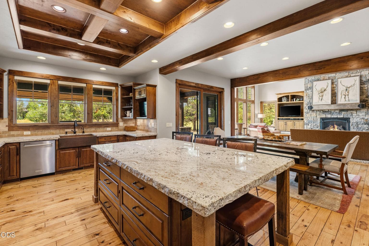 The open-concept kitchen flows seamlessly into the dining area and great room, making entertaining effortless.