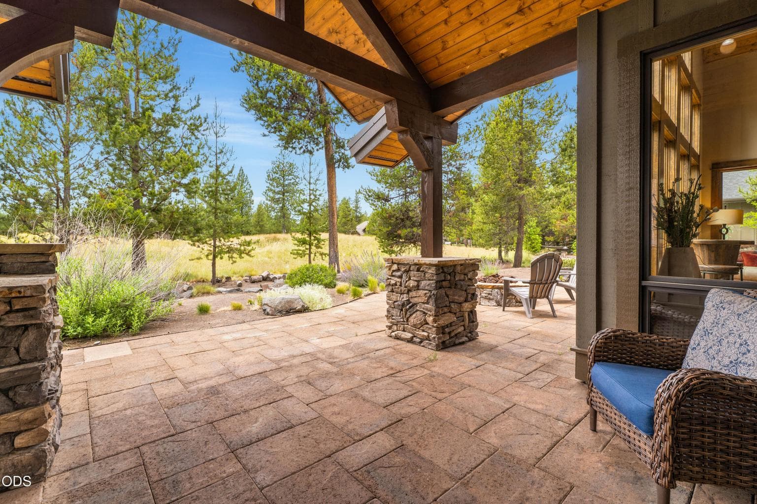 Relax or entertain on the expansive covered paver patio overlooking the golf course and beautifully landscaped surroundings.