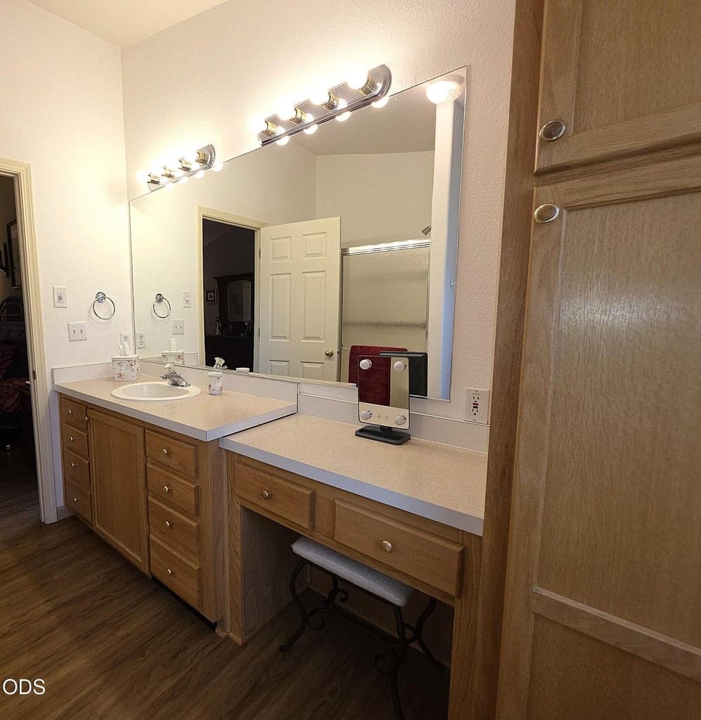 Primary bathroom has linen cabinet