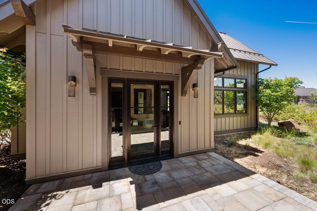 Beautiful glass entry doors allow in natural light.