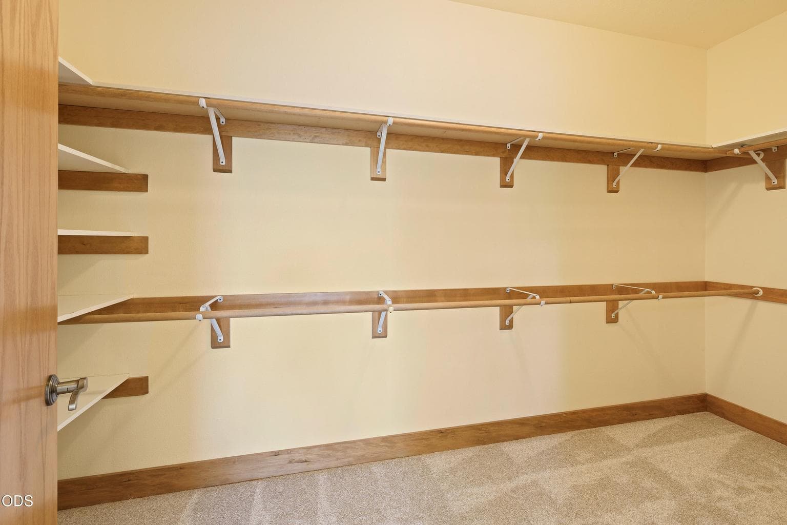Walk-in closet in primary bedroom suite