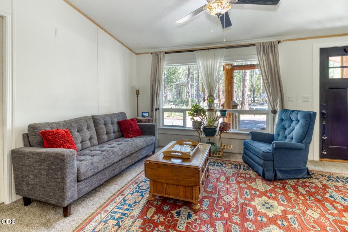 Main Entry/Living room with lots of natural light and ceiling fan