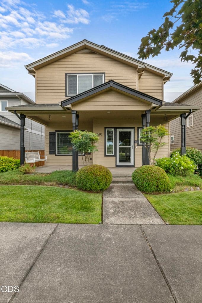 Manicured front landscape gives this home great curb appeal