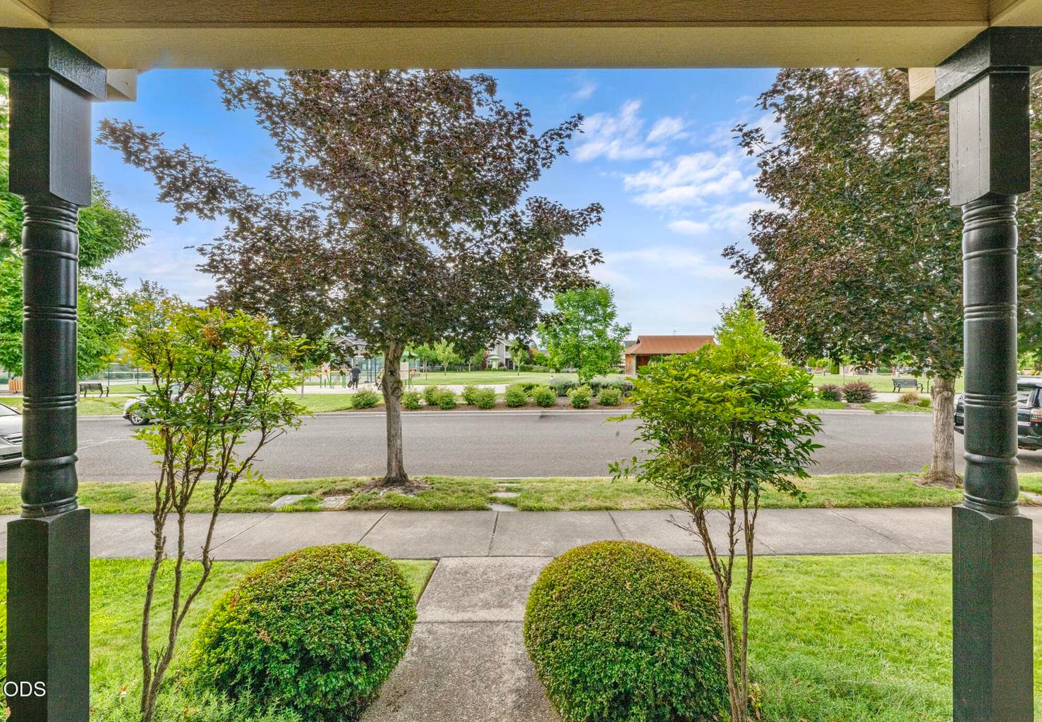 View from your covered front porch- a beautiful park with expansive manicured lawn to enjoy
