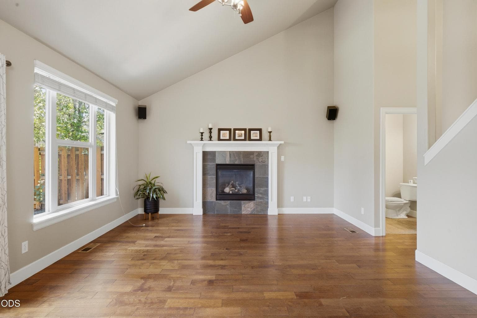 Great Room High Ceiling Open Design next to Stairway