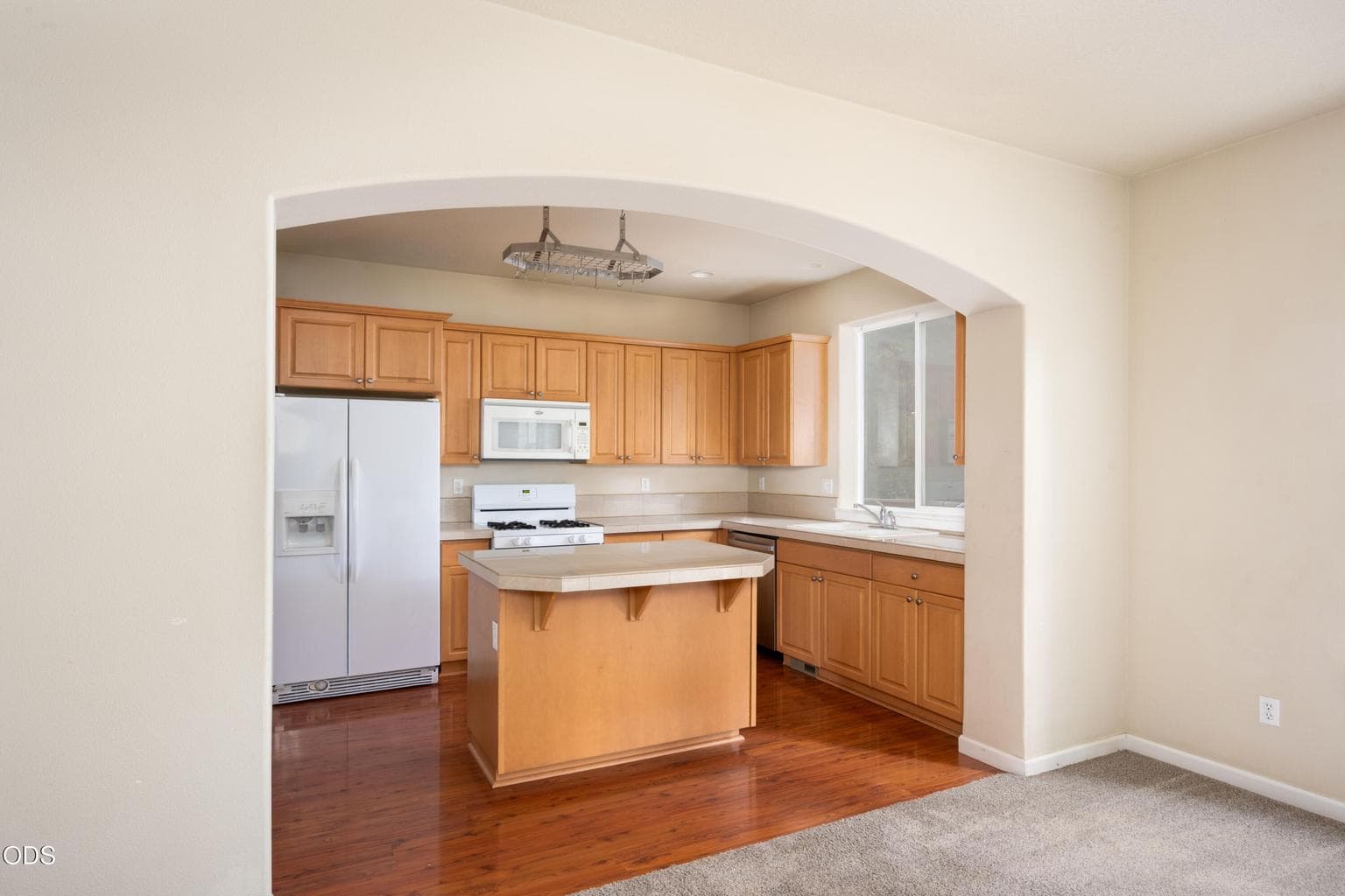 Generous transition from the Family room to the Kitchen