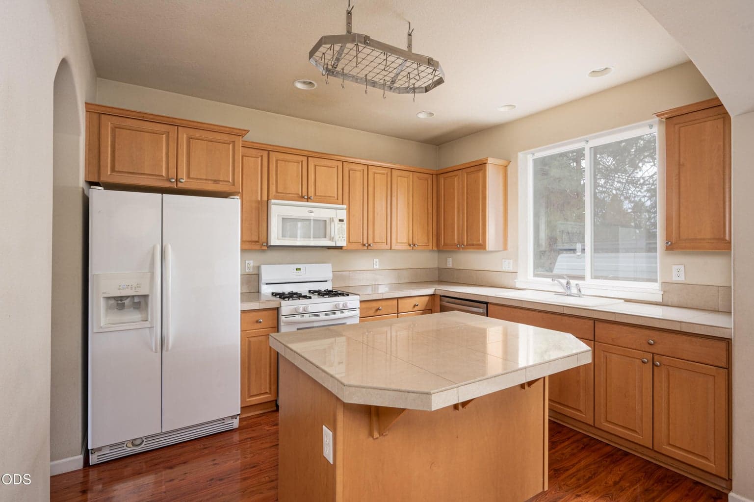 Ceiling mounted pot-rack above the large island