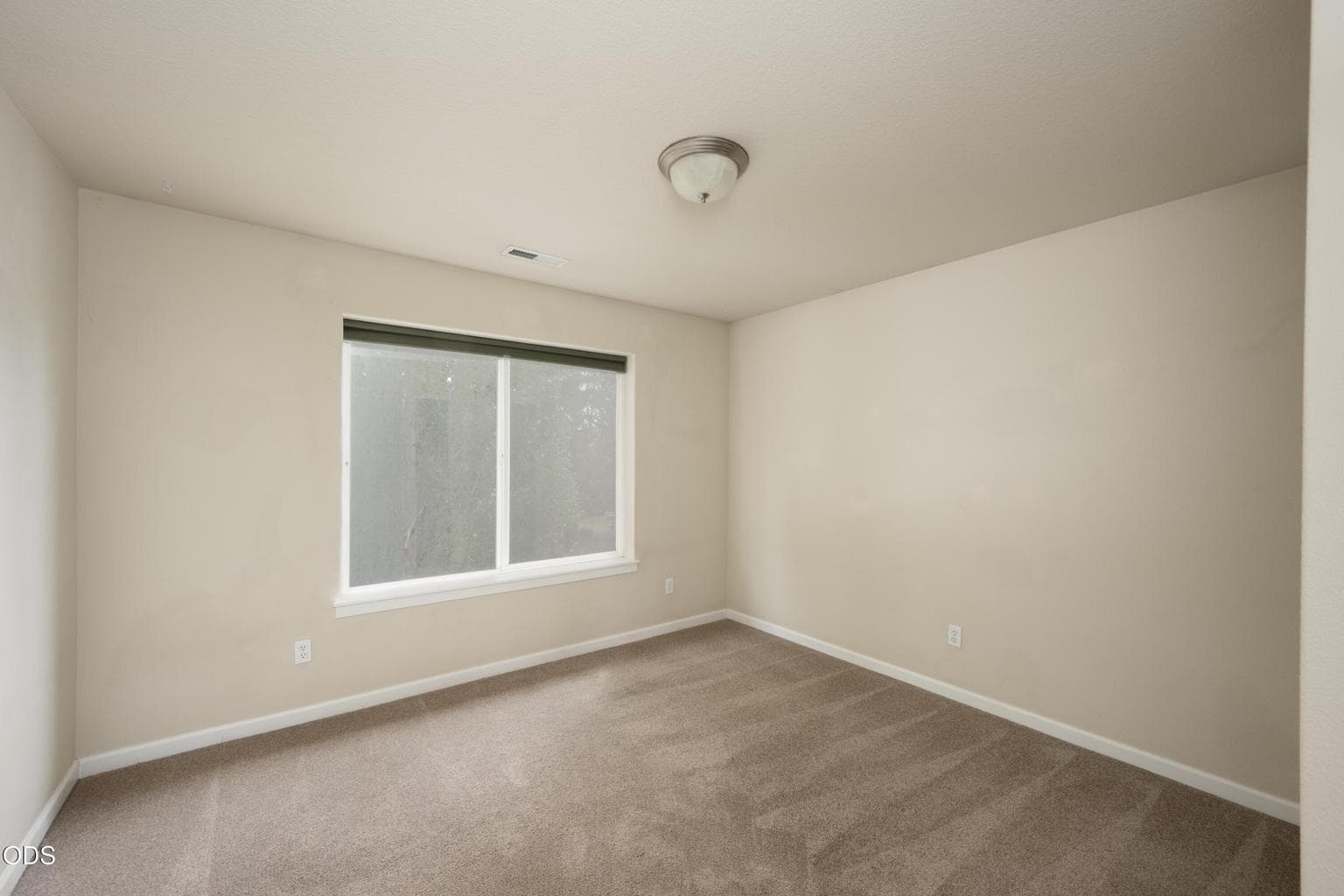 The large bedroom faces to the east and backyard