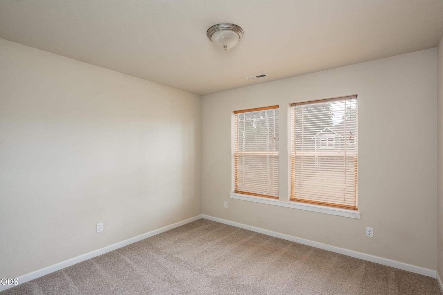Large, spacious bedroom faces West to the front of the house