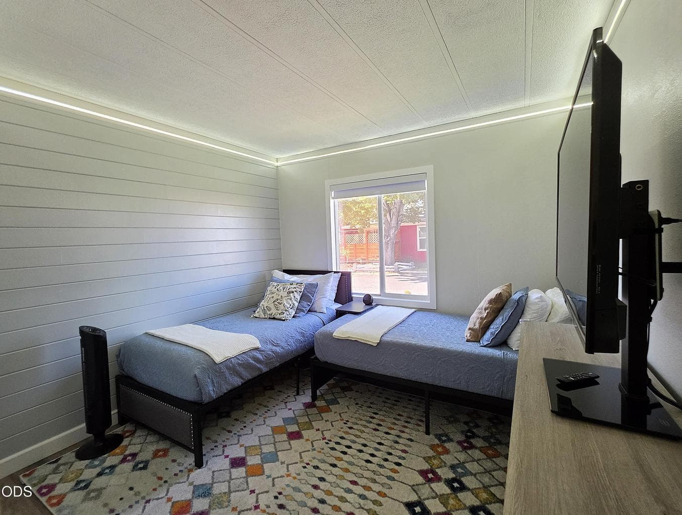 Second bedroom with lighting built into the crown molding