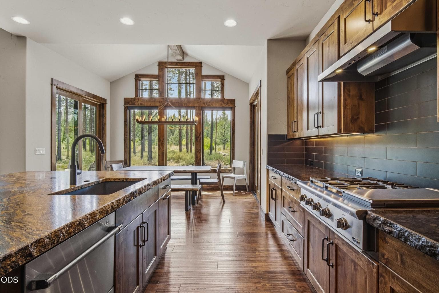 The kitchen and dining area look directly toward the spring-fed nature corridor, creating a daily connection to one of Caldera Springs’ most private and naturally beautiful settings.