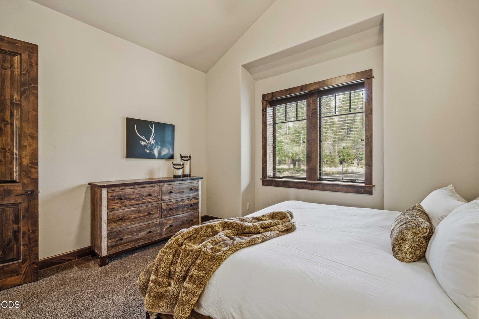 Natural light and warm finishes create a welcoming guest space that feels consistent with the home’s refined Northwest character.