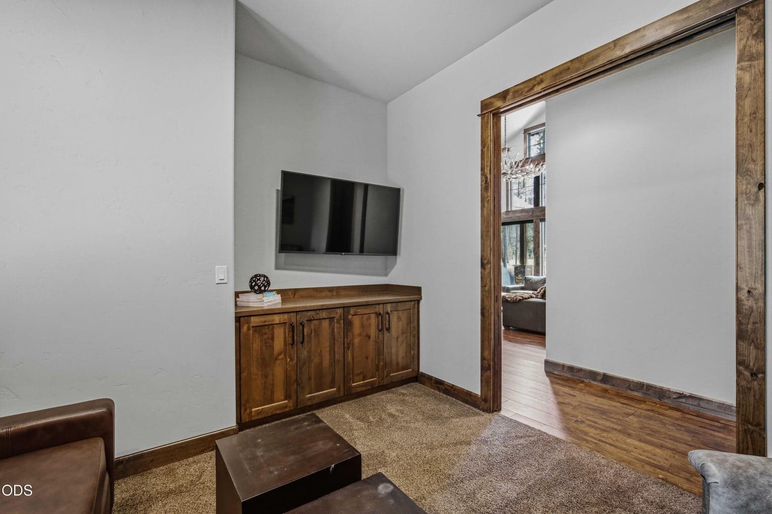The den sits conveniently near the main living area, offering a private retreat that still feels connected to the heart of the home.