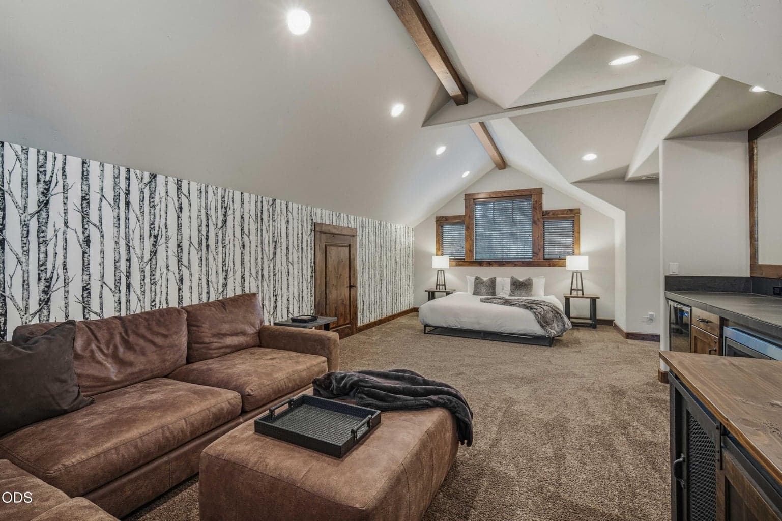 With sleeping, seating, and wet bar areas, the upstairs bonus room offers exceptional flexibility while functioning as the home’s fourth bedroom.
