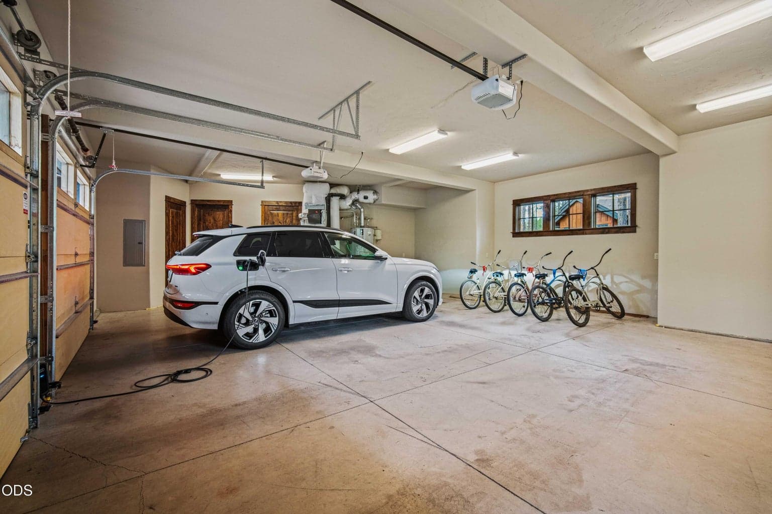 The attached two-car garage provides ample room for vehicles, bikes, and Caldera Springs gear, supporting the easy resort lifestyle.