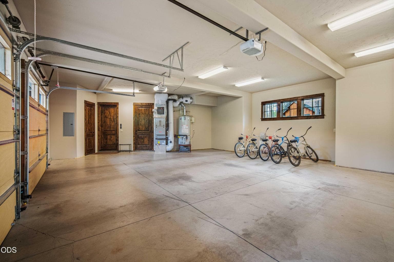 A spacious garage with storage, mechanical access, and room for recreation equipment adds everyday function to this refined retreat.