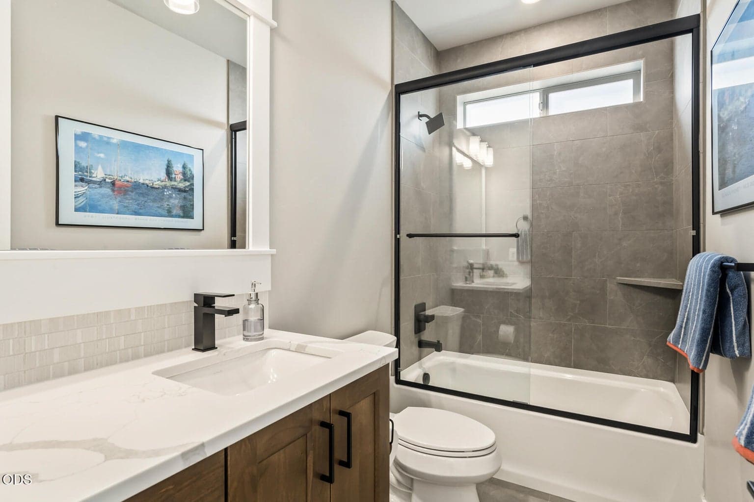 Front bathroom with shower tub combo.